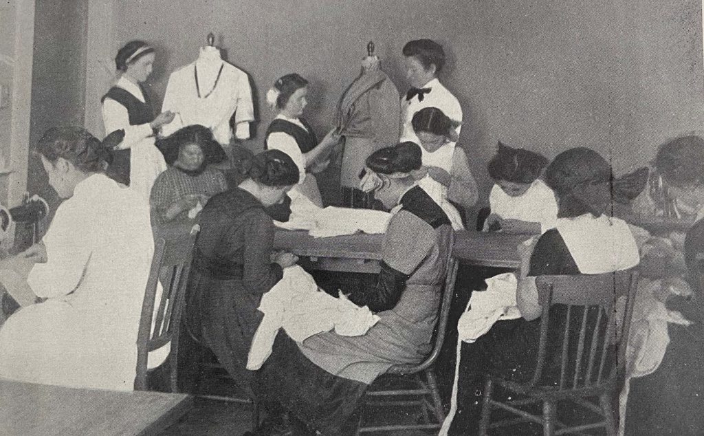 Girls working on dressmaking